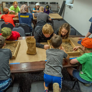 The kids participate in an artifact sorting exercise of objects excavated from the cellar site in June.