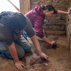 Archaeologists excavate in brick church tower