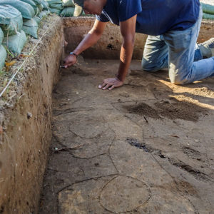 Archaeologist Kalen Anderson at the north Church Tower excavations