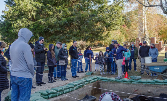 Senior Staff Archaeologist Mary Anna Hartley explains the north Church Tower excavations to visitors.