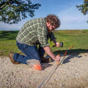 Cole Peterson, Geophysical Specialist at Heritage Consultants, lays out a grid for a magnetometry study of Jamestown's "Smithfield" where Captain John Smith led military drills of the colonists.