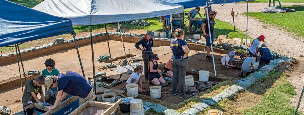 Campers and archaeologists at the cellar site