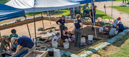 Campers and archaeologists at the cellar site
