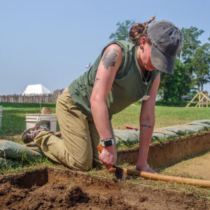 Field School student Ren Willis digging at the clay borrow pit.