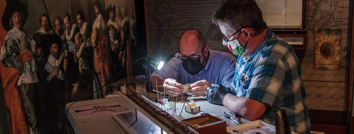 Director of Collections and Conservation Michael Lavin and Curator Dr. Chris Wilkins readying artifacts for the "Gentleman Soldiers" exhibit