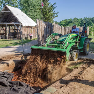 Director of Archaeology David Givens backfills excavations north of the Church Tower.