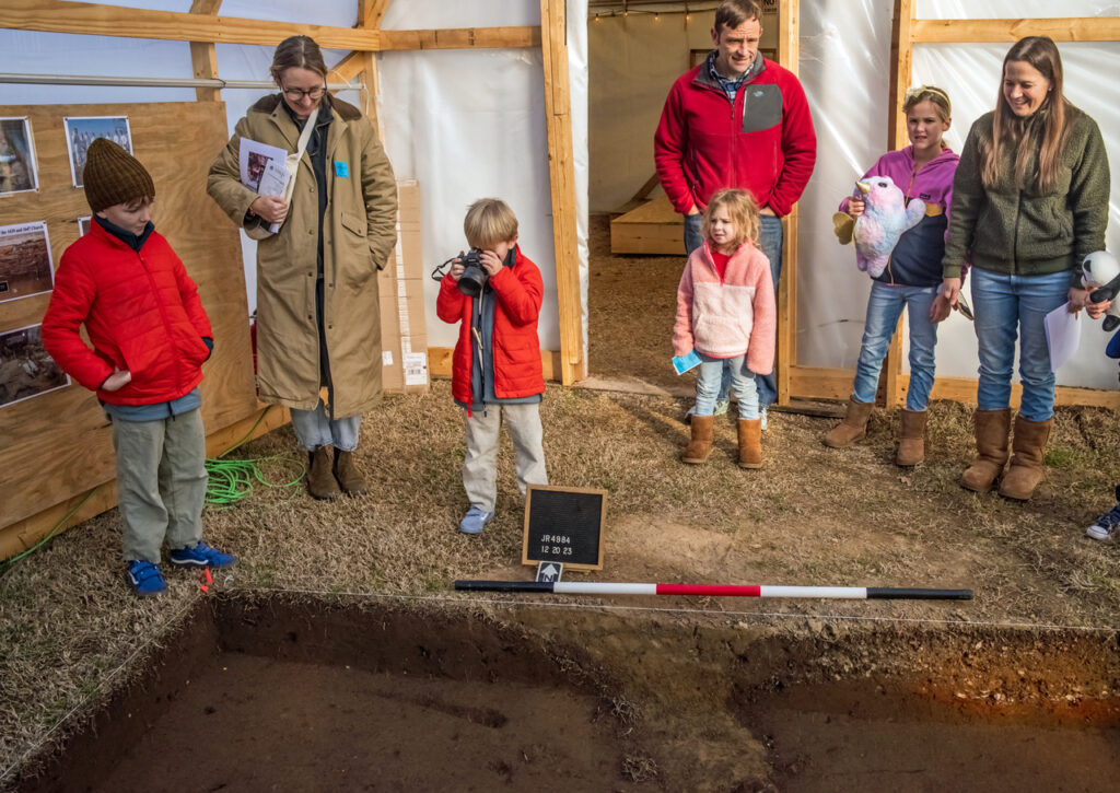 Visitors view the excavations adjacent to the ticketing tent.