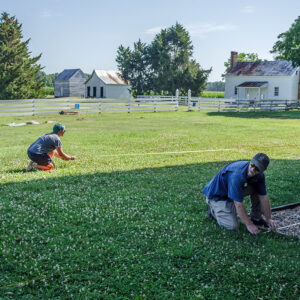 Staff Archaeologist Caitlin Delmas and Senior Staff Archaeologist Sean Romo lay out a grid for the GPR survey at Bacon's Castle.