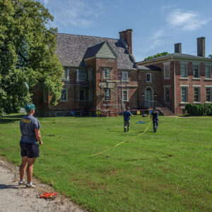 Staff Archaeologist Caitlin Delmas, Senior Staff Archaeologist Sean Romo, and Staff Archaeologist Gabriel Brown lay out a grid for the GPR survey of Bacon's Castle.