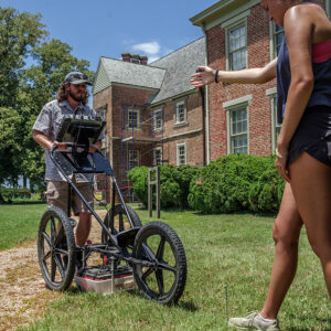 Field school students Richard Fallon and Annabel Lawton conduct a GPR survey at Bacon's Castle.