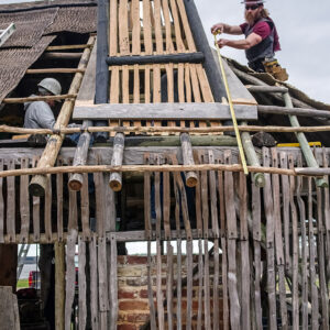 Carpenters Danny Whitten and Jesse Robertson (L-R) work on the Blacksmith Shop's new roof.