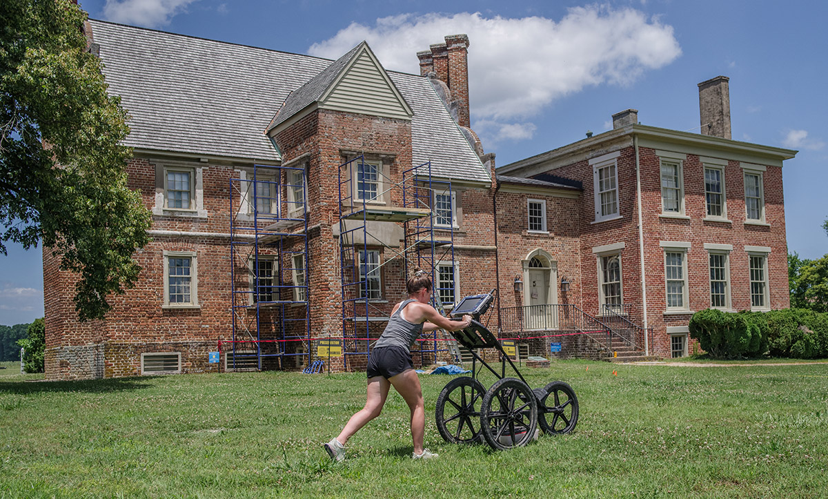 Field school student Ellie Taylor conducts a GPR survey at Bacon's Castle.