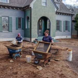 Staff Archaeologist Caitlin Delmas and Archaeological Field Technician Hannah Barch screen soil excavated from the test square in the Jamestown Rediscovery Center's garden area.