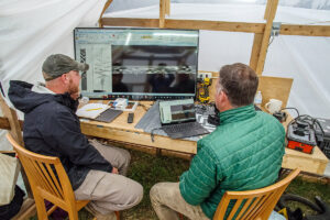 Senior Staff Archaeologist Sean Romo and Director of Archaeology David Givens analyze the results of a GPR survey inside the burial structure.