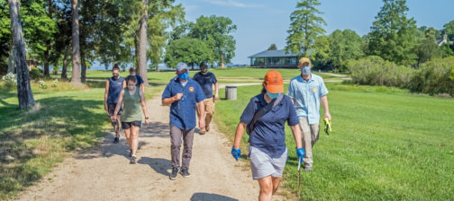 Archaeologists walking along a path