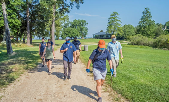 Archaeologists walking along a path