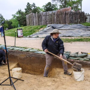 Archaeological Field Technician Hannah Barch removes the upper layers of a section of the 1608 ditch.