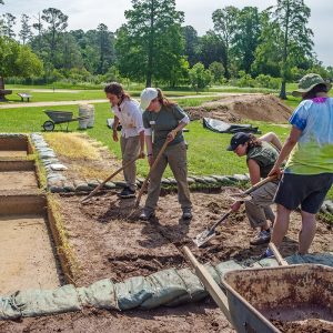 Staff Archaeologist Natalie Reid supervises field school excavations south of the Archaearium.