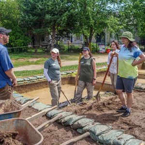 Director of Archaeology Sean Romo discusses the excavations south of the Archaearium with field school students.