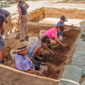 Campers from the first session excavating just south of the Archaearium.