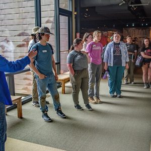 Archaeologist and Director of the Voorhees Archaearium Museum Jamie May gives a tour of the Archaearium to field school students.