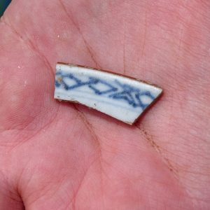 A sherd of 18th century Chinese porcelain found in the cellar excavations