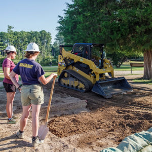 Archaeologists filling in one of the squares at the north Church Tower dig site after the completion of excavations there.