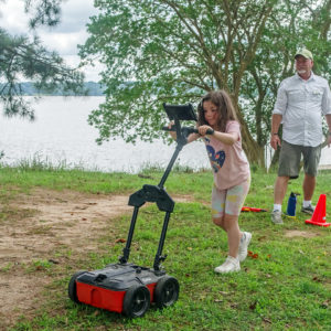 A camper conducting a GPR survey outside James Fort.