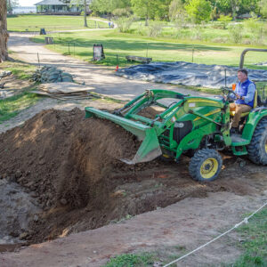 Director of Archaeology David Givens fills in the Governor's Well.