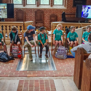 The campers discuss their experiences at camp with their families on the last day.