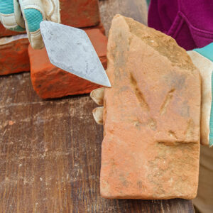 A brick from the Governor's Well with a bird's footprint