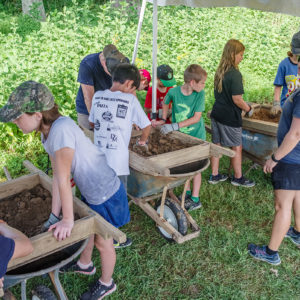 Campers screening for artifacts in the fill from the Confederate moat.