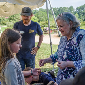 Senior Curator Merry Outlaw identifies some of the finds from the Confederate moat.