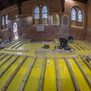 Church interior with in-progress floor renovation