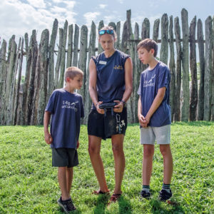 Field Supervisor Anna Shackelford teaches drone operation for archaeological photography.