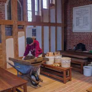 Archaeological Field Technician Ren Willis screens for artifacts from soil excavated during the Church Tower dig.