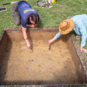 Archaeological Field Technician Eleanor Robb and Staff Archaeologist Natalie Reid score features prior to record photography in one of the Smithfield excavation squares.