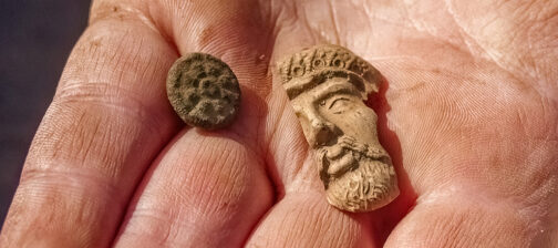 A button and partial Turk's head pipe found in the Godspeed Cottage excavations