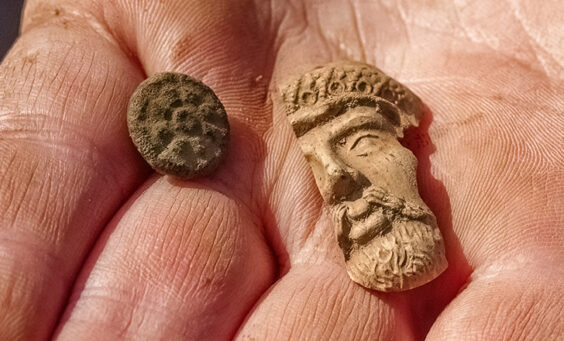 A button and partial Turk's head pipe found in the Godspeed Cottage excavations