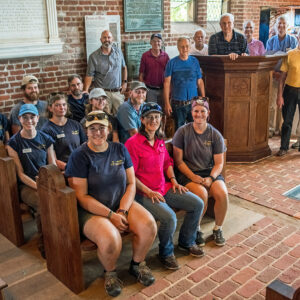 The Ford's Colony Woodworkers pose with the pulpit, the archaeological team, and other Jamestown Rediscovery staff.