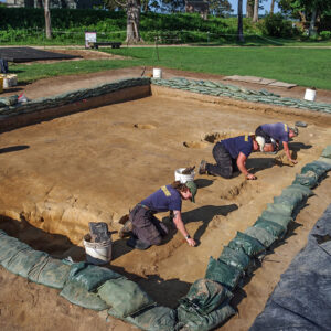 Archaeological Field Technicians Ren Willis and Hannah Barch, and Staff Archaeologist Caitlin Delmas excavate a palisade wall in the north field.