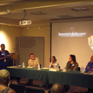 Four member panel sits at a table