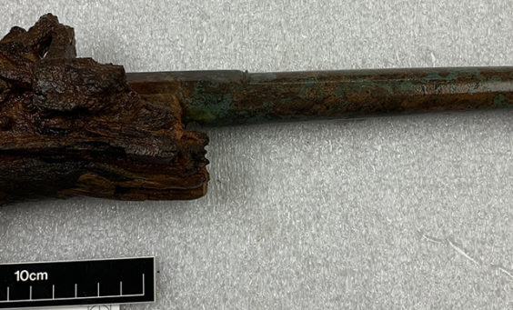 conserved pistol with corroded stock