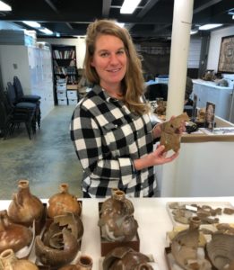 Jamestown Rediscovery Curator Leah Stricker with some of the many Bartmann jugs excavated at Jamestown.