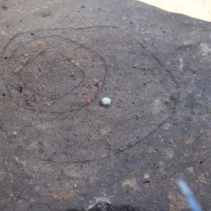 The new pit, posthole, and ball-like artifact at the north Church Tower excavations.