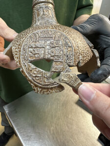 A new piece found in the artifact archives that mends with a Bartmann jug on display in the Archaearium. The conservation and collections teams need to remove the reversible adhesive on some of the pieces to mend the new piece.