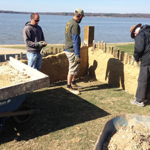 Archaeologists examine reconstructed low church wall