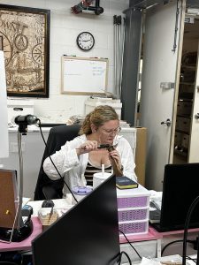 Assistant Curator Magen Hodapp measures a cow bone to create data for the cattle morphometric project.