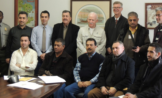 Staff and delegation pose for a group photo