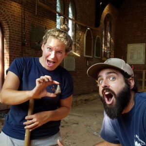 Curator (and archaeologist) Leah Stricker holds a megalodon tooth that she found during excavations in the Memorial Church in 2017. Fellow archaeologist Bob Chartrand was surprised (and jealous).